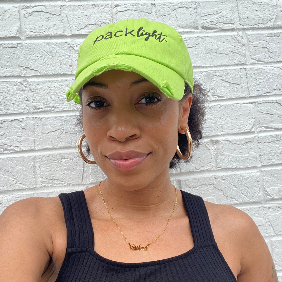 model shaneka sanford modeling lime Pack Light affirmation hat from Sol Rise Essentials